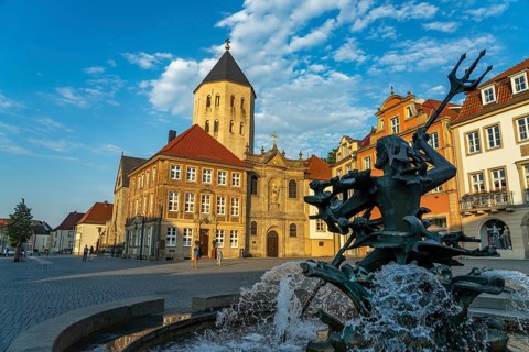 Neptune Fountain and Gau Church on the market square in Paderborn, North Rhine-Westphalia, Germany
