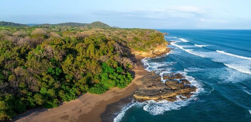Aerial view, rainforest, sandy beach and coast with waves, Playa Cocalito, Puntarenas, Costa Rica