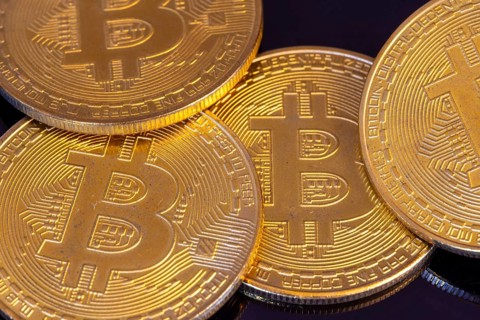 Close-up of symbolic bitcoins