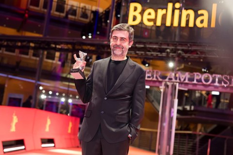 Emin Alper poses with the Silver Bear as director of the film Kurtulus (Redemption) after the award