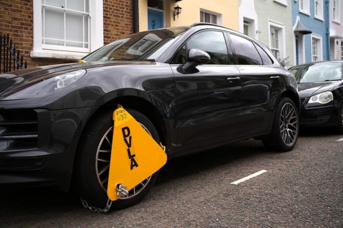 Yellow wheel claw, parking claw, the DVLA Driver and Vehicle Agency, an Porsche, anti-theft,
