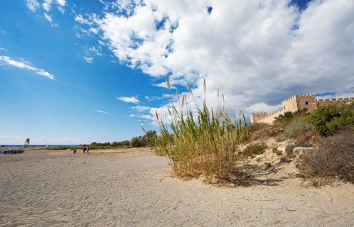 Beach in Frangokastello on the Libyan Sea, on the right the Venetian fortress, in the back the