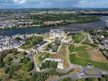 Aerial view of the historic Château de Saumur with its distinctive round corner towers and bright