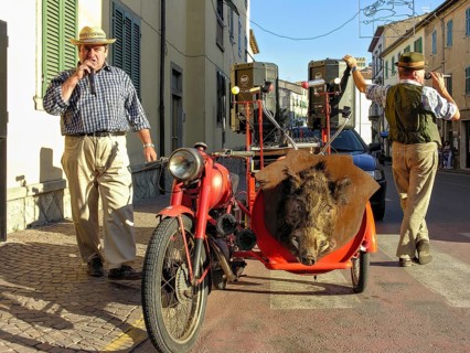 Street musicians singing at street festival, Moto Guzzi vintage motorbike, sidecar with hunting
