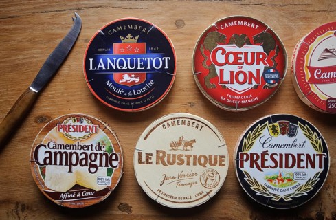 Camembert cheese boxes, various french camembert cheese brands, knife for cheese