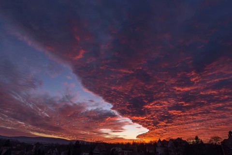 A red evening sky with cumulus clouds (stratocumulus) over Bautzen, Upper Lusatia, Saxony, Germany