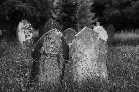 Weathered graves, headstones, municipal cemetery, Falmouth, Cornwall, black and white, England,