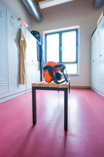 Changing room with lockers, a window and a helmet on a table, Bauhof, Calw, Calw district, Germany