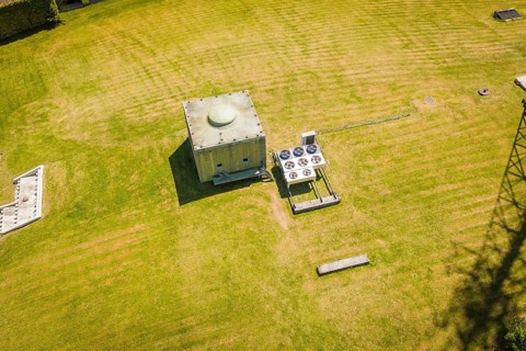 A technical building on a mowed green field, Bunker Anlage, Calw, Germany