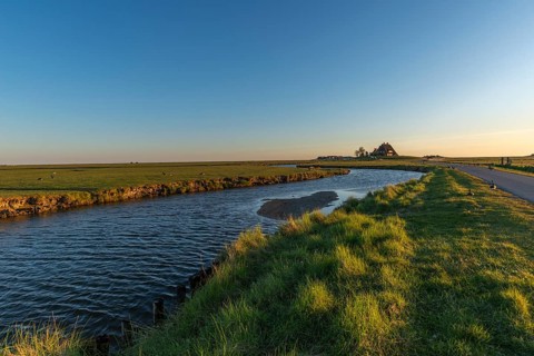 Kirchwarft with pastor and church on Hallig Hooge in the Schleswig-Holstein Wadden Sea National