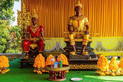 Two temple guards armed with swords sitting on a pedestal, Wat Phra That Doi Suthep temple complex,