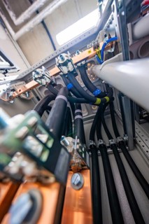 Electrical cables and copper connections in the interior of a technical room, electrical system for