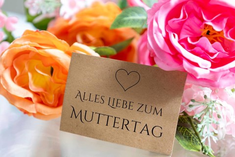 Loving Mother's Day greeting on a card surrounded by flowers (with added text ALL THE LOVE FOR