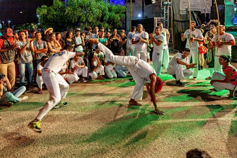 Two capoeira fighters show quick movements in a thrilling performance, The Capoeira Battle Dance at