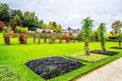 Autumn colors over Powis Castle and Garden, Welshpool, Powys, Wales, UK
