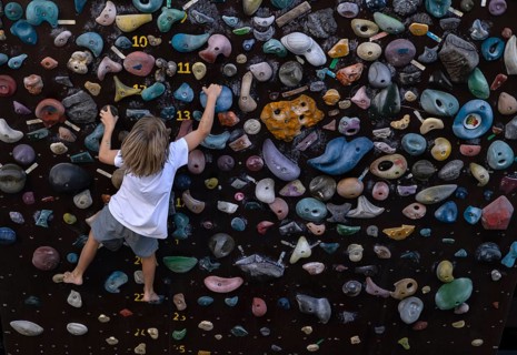 Boy, 7 years, blond, climbing on climbing wall, bouldering, bouldering wall, Stuttgart,