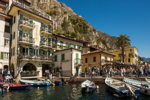 Picturesque village and colorful houses on the lake and steep mountains, Limone sul Garda, Lake