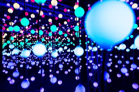 Light, glowing balls, LED lamps, hang in series, side by side, on top of each other, change their