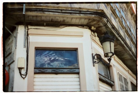 A quaint vintage bakery with a charming storefront featuring rustic architectural details, inviting