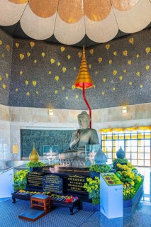 Buddha statue in modern temple room with golden decorative elements, Queen Pagoda, Doi Inthanon