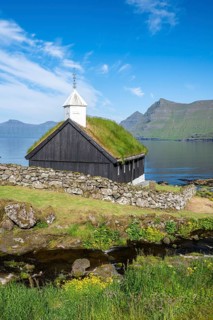 Funningur wooden church, church with grass roof on the fjord, Eysturoy island, Faroe Islands,
