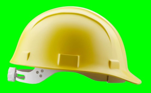 Yellow construction hard hat isolated on a green screen