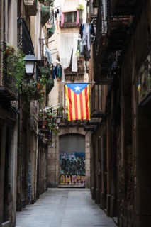 A flag of the Estelada of the Catalan Nationalists in an alley of the historic centre of Barcelona,