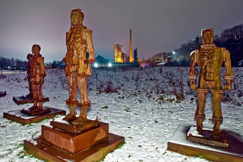 People made of iron, multi-part iron sculpture by Zbigniew Fraczkiewicz in front of the