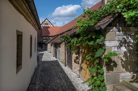 Inner courtyard with former so-called church arcades, barns in the historic fortified church,