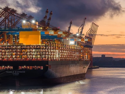 Aerial view at Waltershof harbour during the Blue Hour at the berths of Eurogate Container Terminal