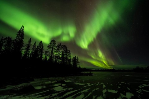Northern Lights (Aurora borealis) over a frozen lake, Norrbotten, Lapland, Sweden, October 2022