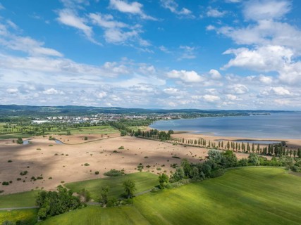 Aerial view of Mooser Damm with state road L192 which crosses Radolfzeller Aachried on the shore