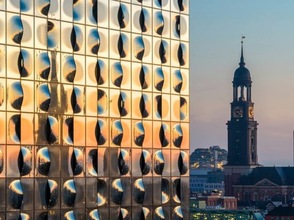 Aerial view of the sunrise on the Elbe with Elbe Philharmonic Hall and St Michael's Church