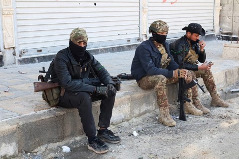 In Aleppo, Syria on January 10, 2026, Syrian Army soldiers deploy throughout the Sheikh Maqsoud and