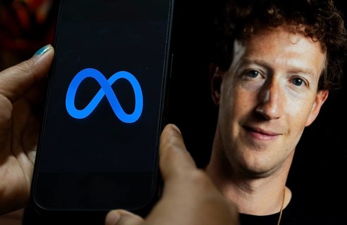 In this photo illustration, a smartphone displays the Meta logo on its screen with an image of Meta