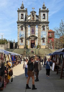 People in front of the Igreja Paroquial de Santo Ildefonso, catholic church, exterior façade