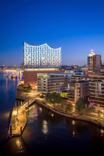 Aerial view of sunrise on the Elbe with Elbe Philharmonic Hall and reflections in the glass façade,