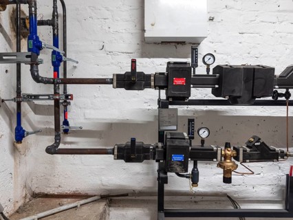 District heating transfer station in a cellar in Düsseldorf, Germany