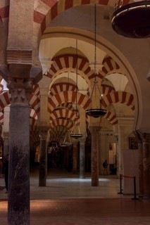 Vaulted interior with high columns, ceiling lights and red and white arch details, Cathedral Mosque