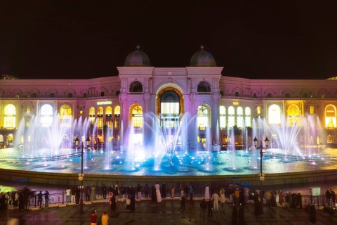 Doha, Qatar - 15th january 19th, 2026: Illuminated Place Vendome Mall at night with reflecting pool