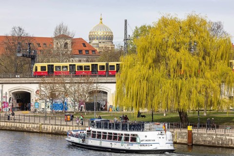 Spree with aerial boat and S-Bahn. View of the New Synagogue Berlin, Centrum Judaicum from Museum