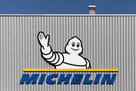 Michelin, company logo with Michelin man, Bibendum, on a warehouse, Logoport, Duisburg, North