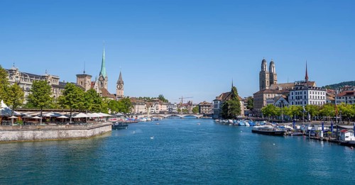 View from the Quai Bridge over the Limmat to the towers of Zurich's Old Town, Zurich, Switzerland
