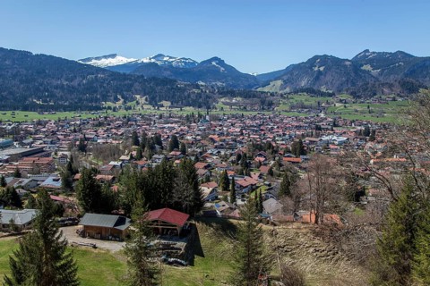 View from Cafe Breitenberg to Oberstdorf, behind mountains of the Allgäu Alps with Hoher Ifen,