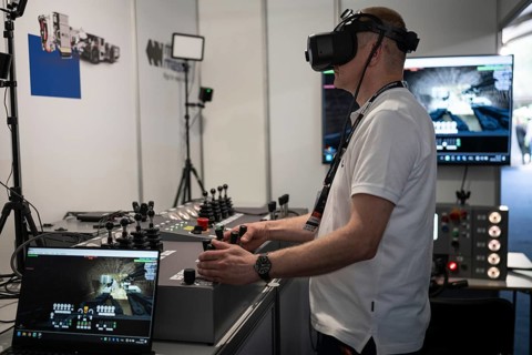 LUBIN, POLAND - JUNE 6, 2025: International Mining and Metallurgy Congress in Lubin.A man in VR