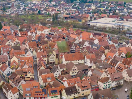 Village view with closely packed houses and red roofs in an urban setting, Großbottwar, Ludwigsburg