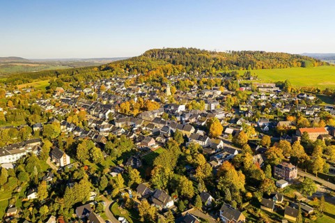 Aerial view of the mountain town Scheibenberg with mountain Scheibenberg in autumn, Erzgebirge,