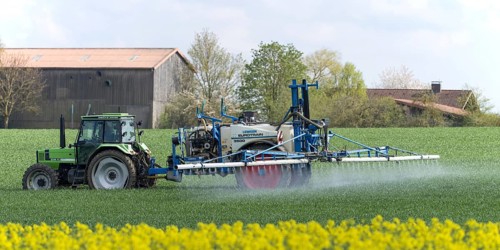 Agriculture, pesticide being sprayed on a field in spring, Swabian Alb, Baden-Württemberg, Germany