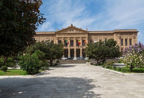 Neoclassical style Zanca Palace or the Messina Town Hall building facade through landscaped park