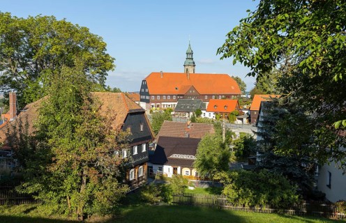 Striking view of the village with church, Niederkretscham nature park Park House and typical